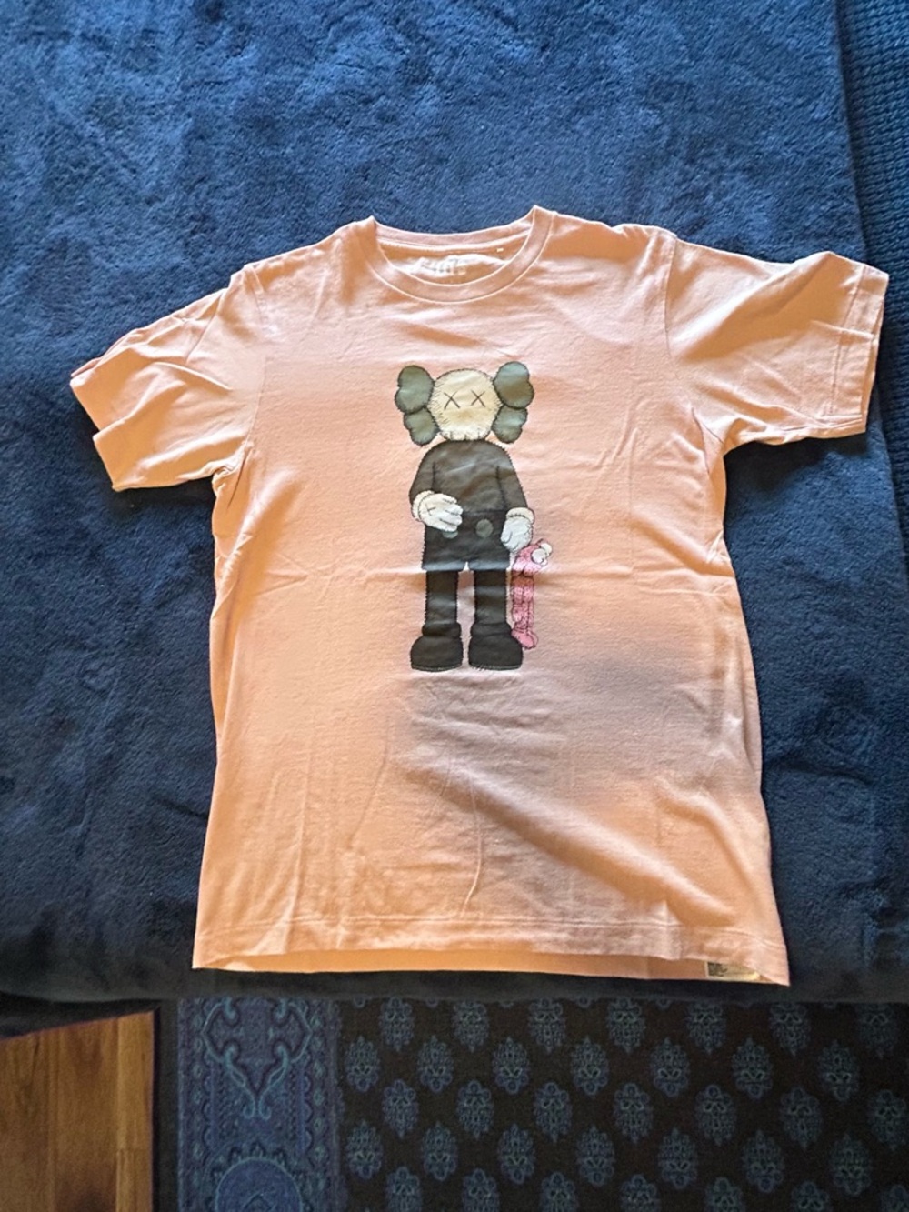 KAWS x Uniqlo UT Companion Tee in pink